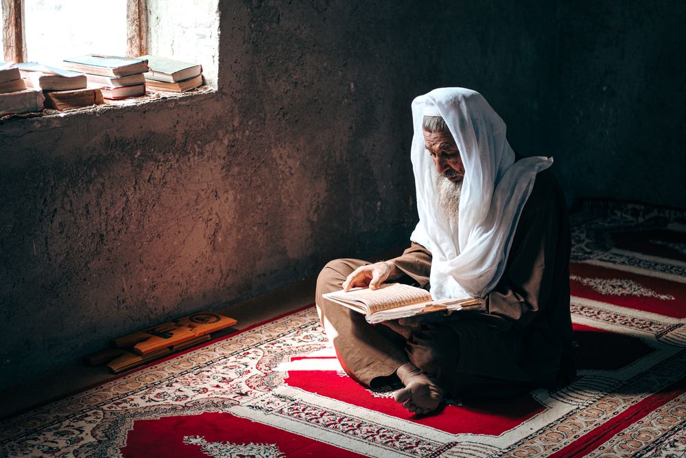 Maulvi reads the Quran in the mosque