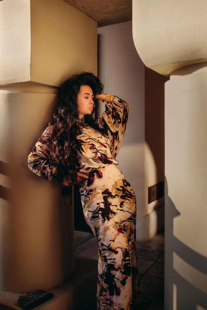 Beautiful black-haired woman wearing colorful dress