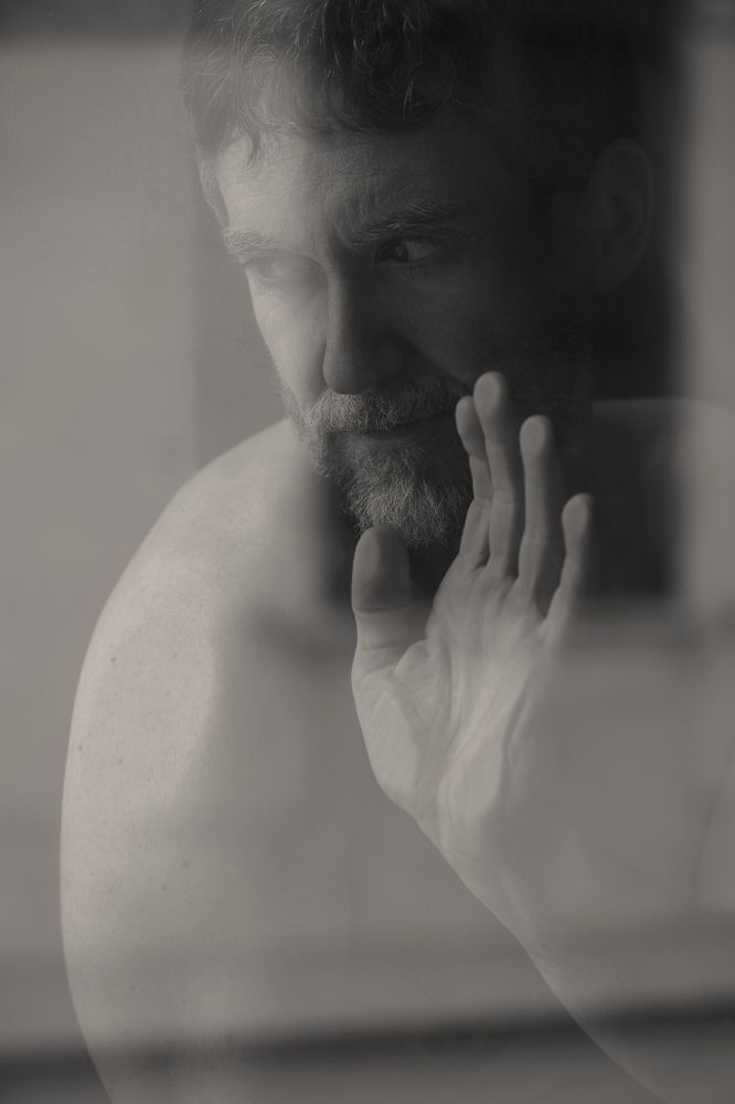 Self portrait behind the window