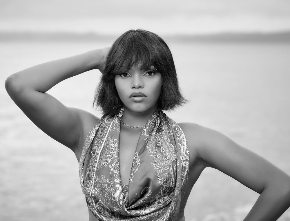 Half portrait of girl sitting on stone rock