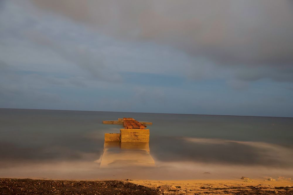 old pier at the sea