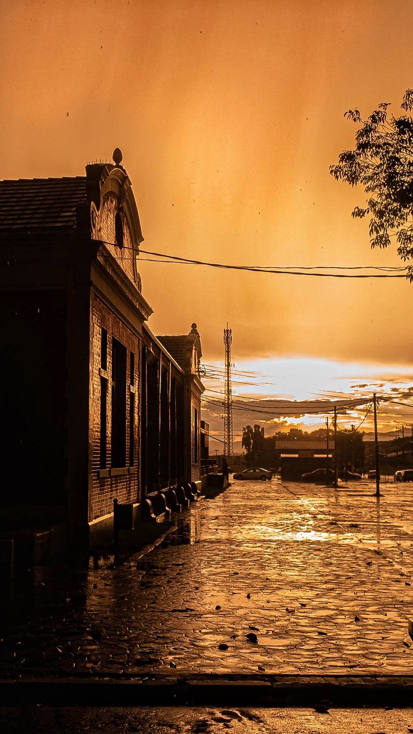 Railway station on a rainy golden sunset