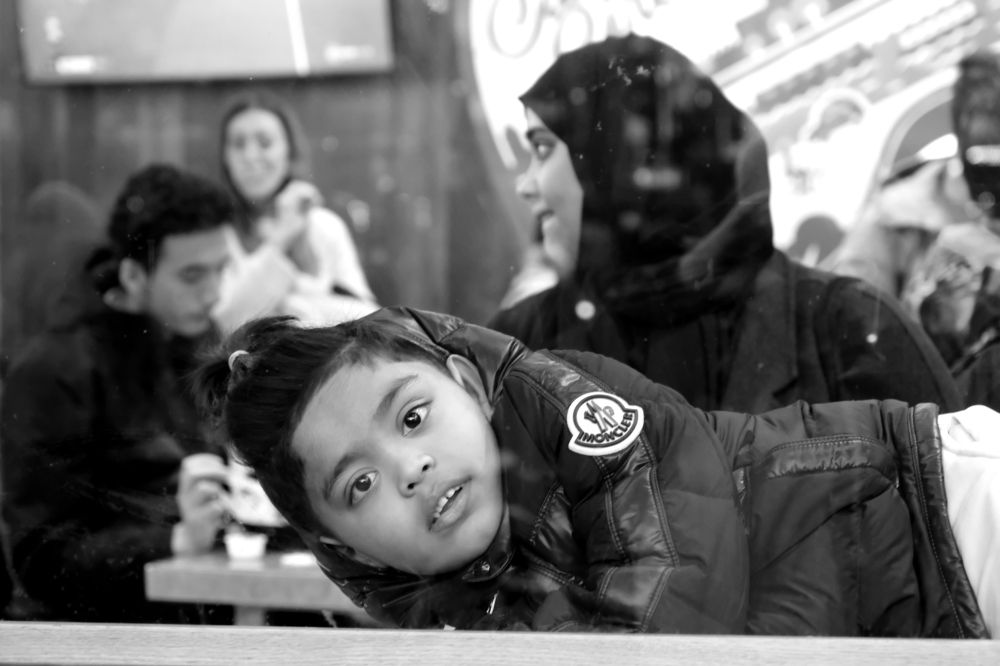 Unknown Girl Laying in The Caffee Table