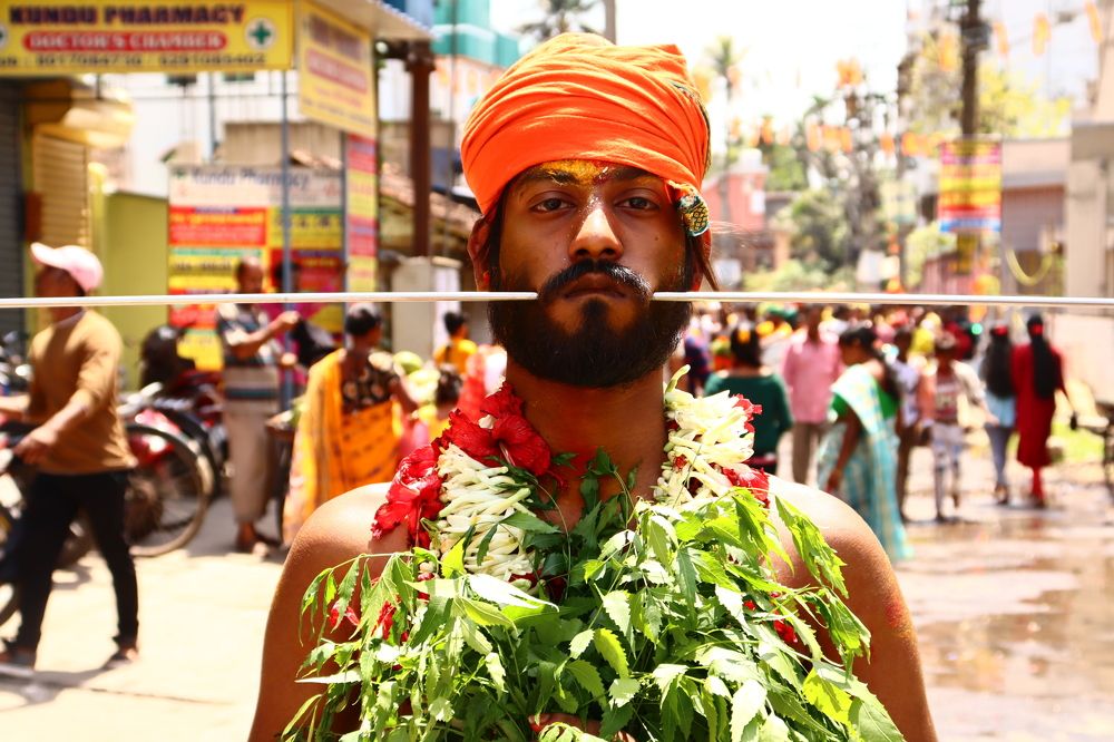 GOD DEVOTEE WITH PIERCED CHEEKS