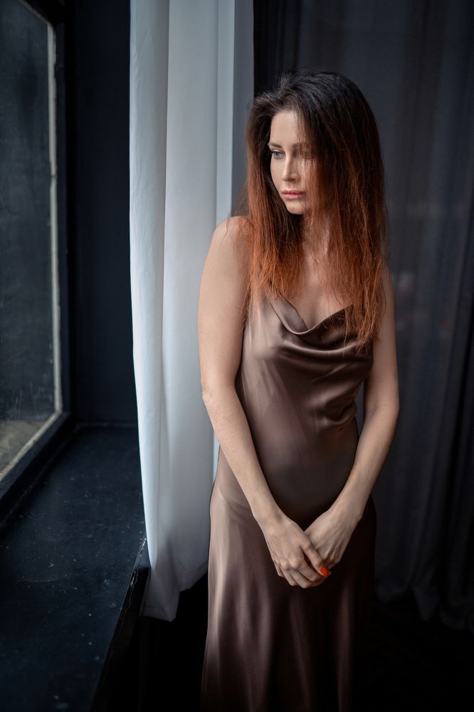 Portrait of woman near the window