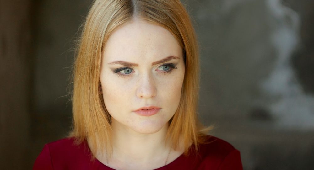 Oktyabrina with a surprised and intent look