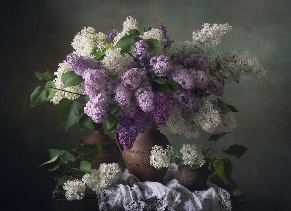 Bouquet of lilacs in an old jug