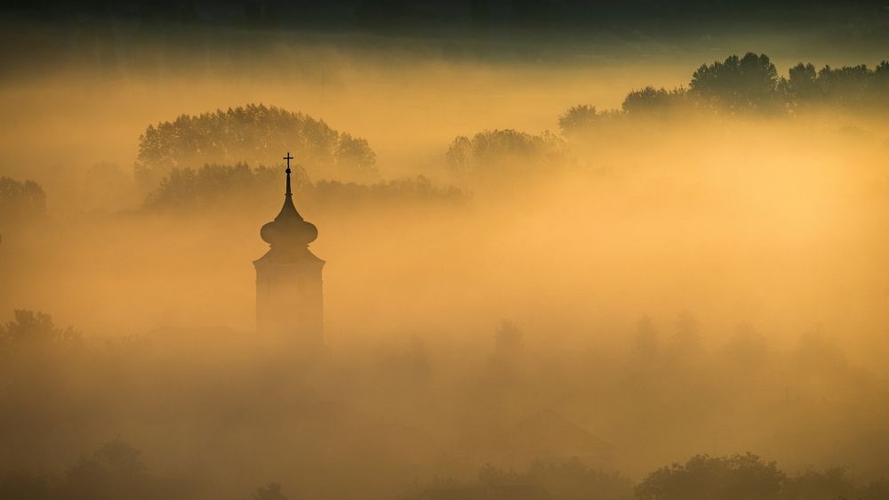 Cross in the golden mist