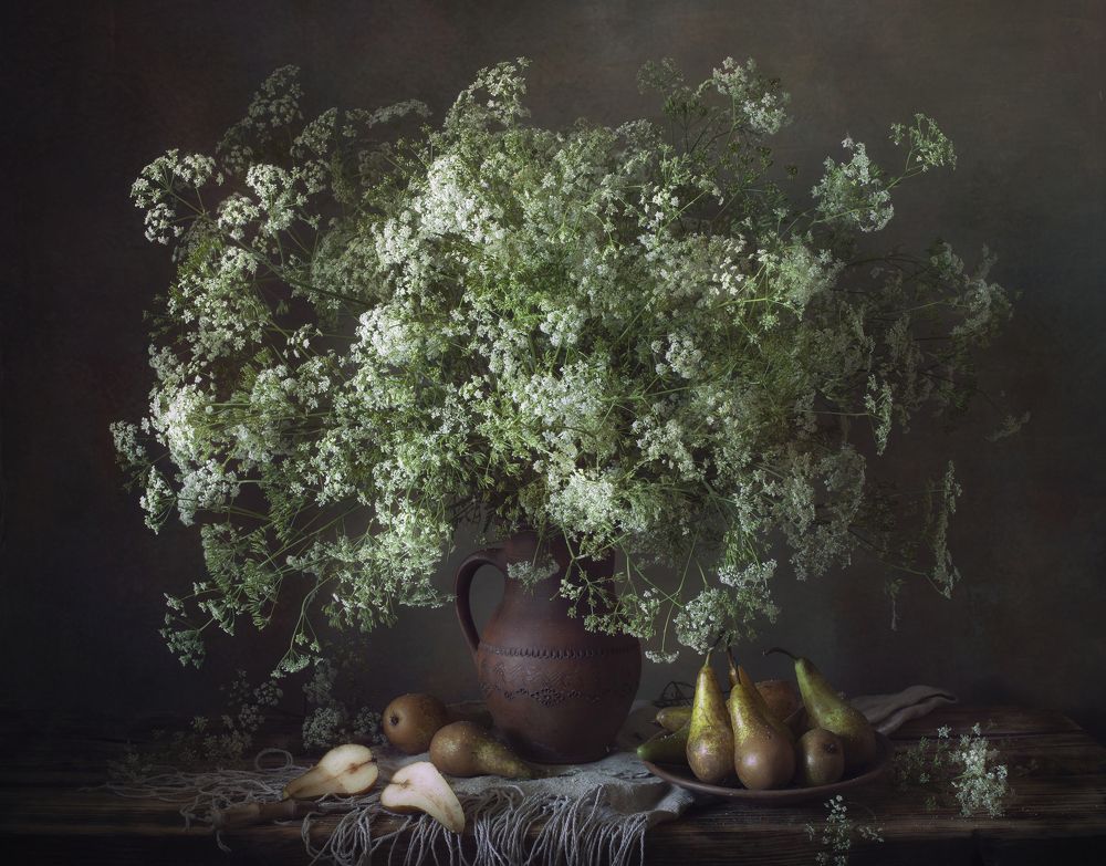 Still life with wildflowers and winter pears