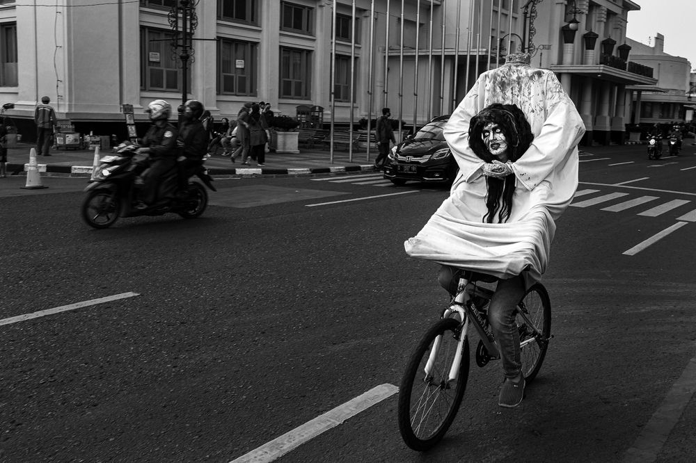 Ghost rides a bicycle