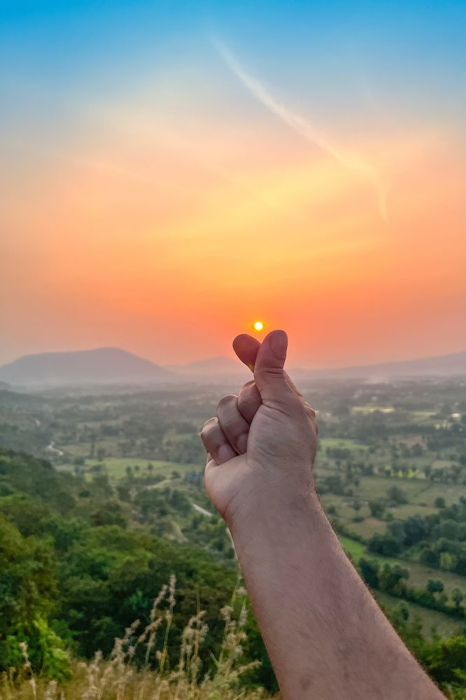 Sunset with hands