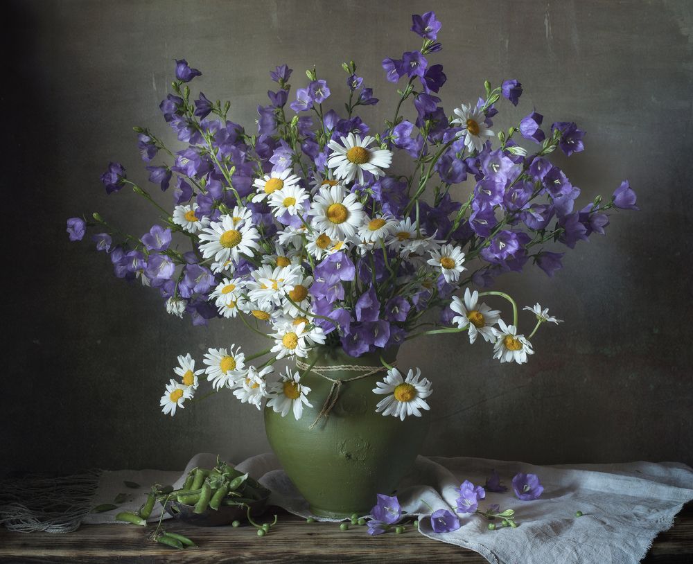 Still life with daisies and peas