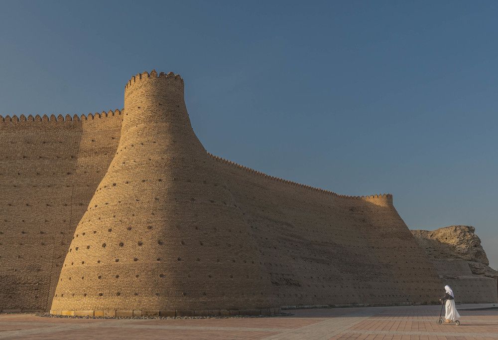 На самокате.