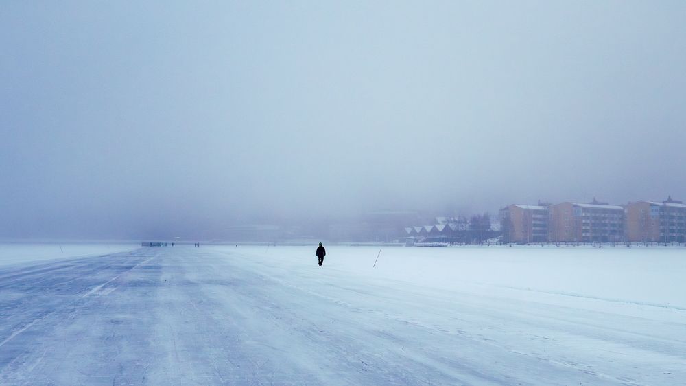 Into the Mist: A Solitary Stroll on the Frozen Sea