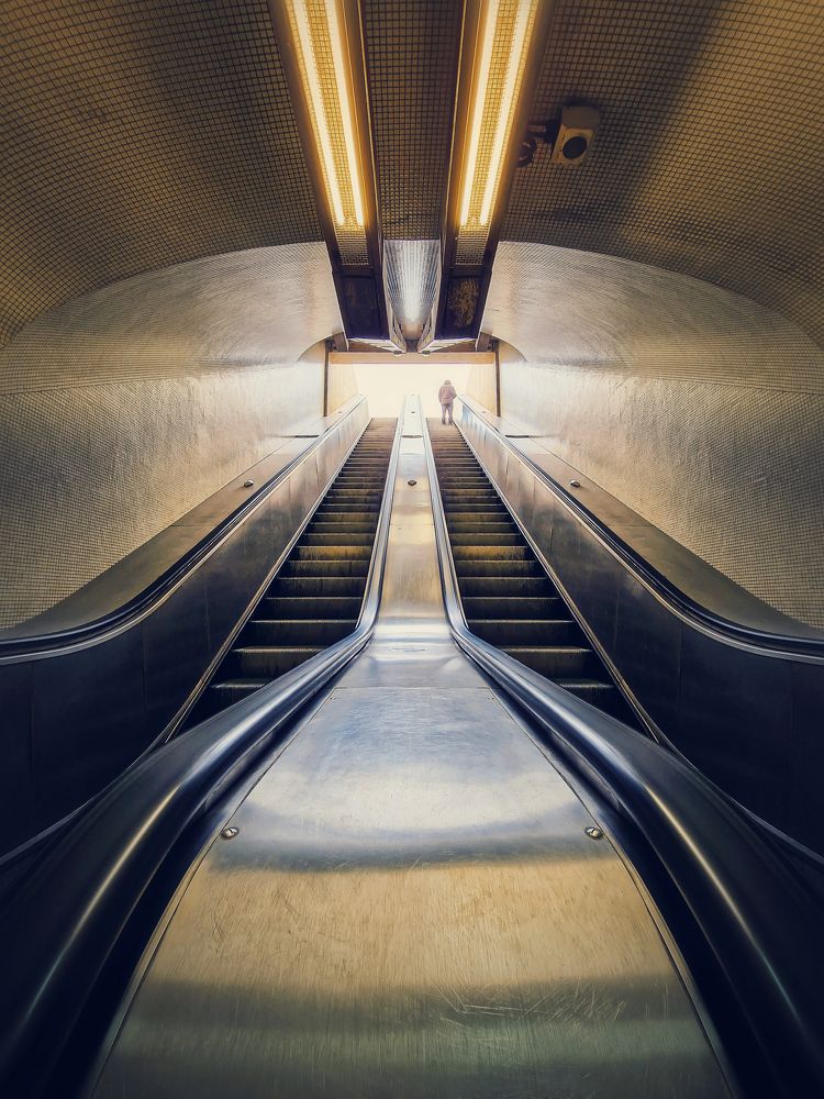 climbing a subway escalator
