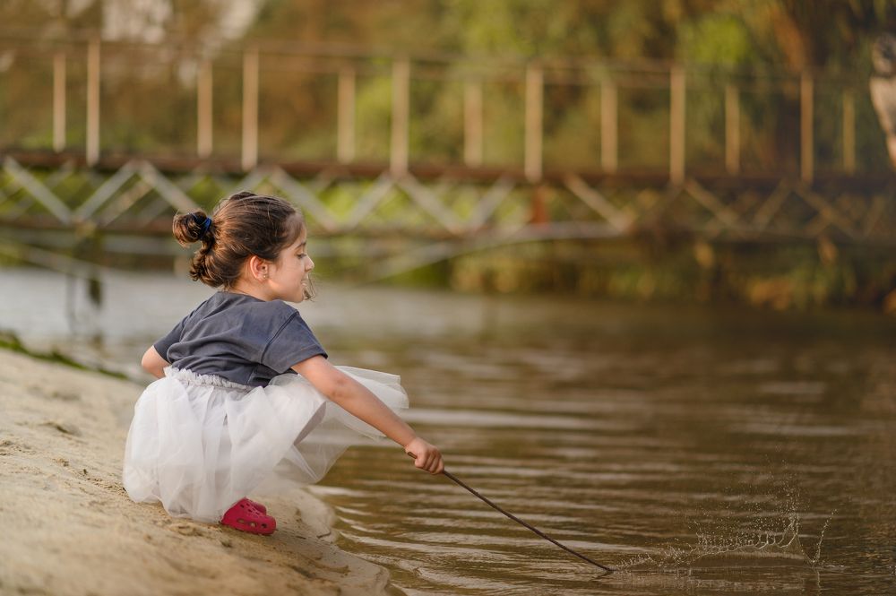 By the river she sat ...