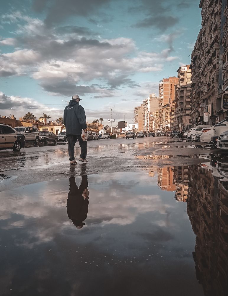 Reflection of man in water