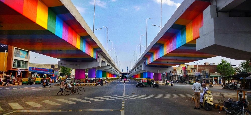 In the fast-paced cityscape, even the pillars break the monotony with colors that speak volumes.