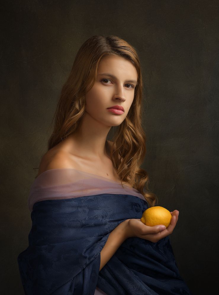 Girl Holding a Golden Lemon