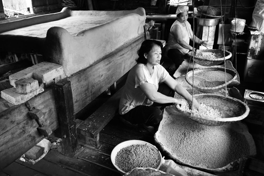 Melanau women processing sago pearls