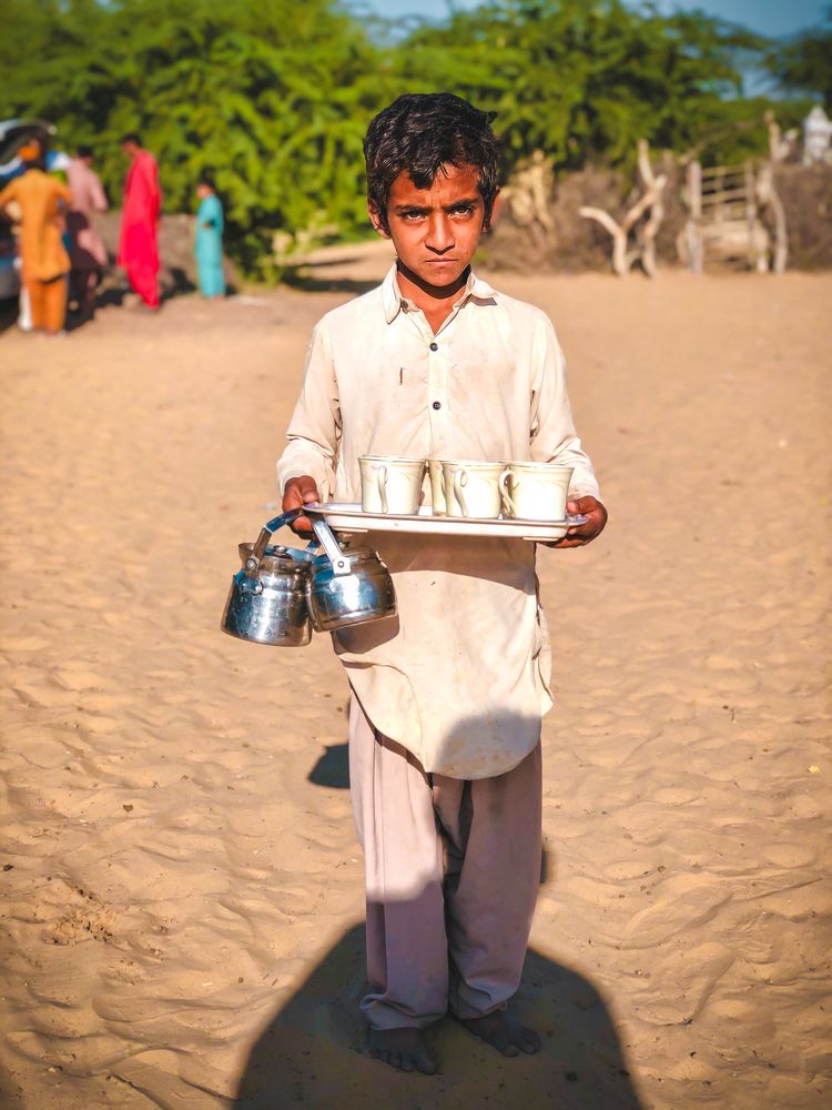 Offering tea to the guests