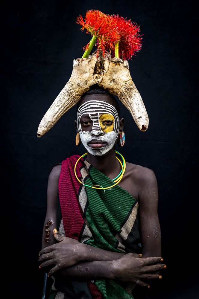 A young woman with traditional jewellery. Surma Tribe | Ethiopia