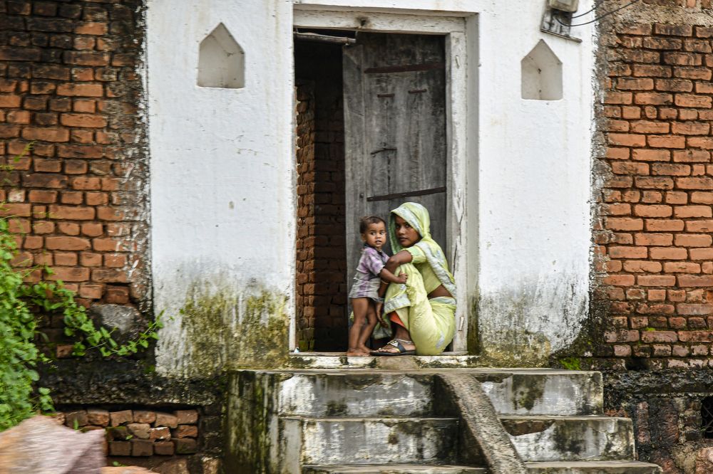 A young mother with her son in India.