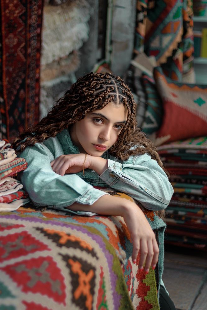 Iranian girl and Persian carpet