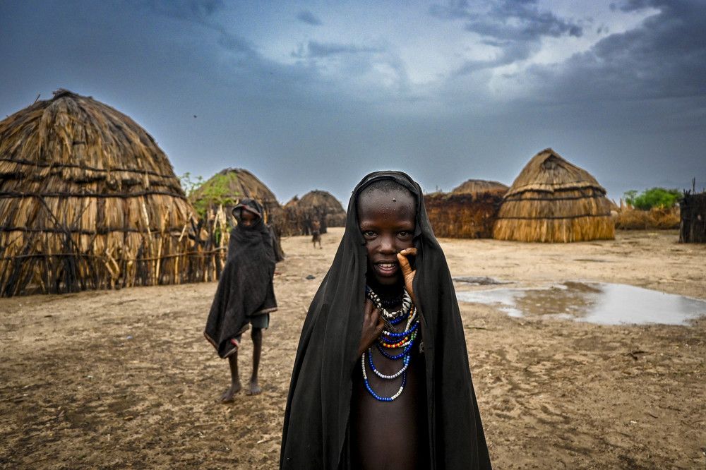 Walk through the village of the Arbore tribe.