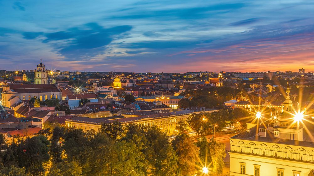 Panoramic view of Vilnius Oldtown against sky at sunset