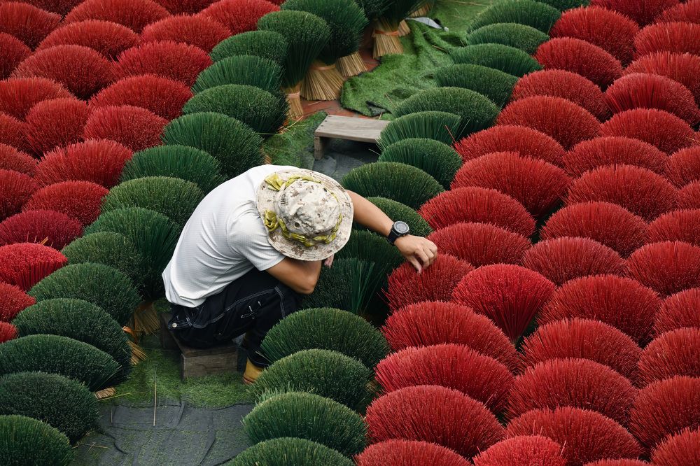 man checking incense