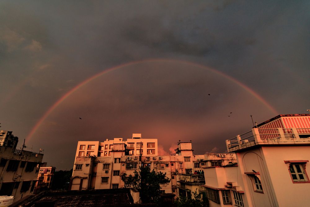 City under the rainbow sky