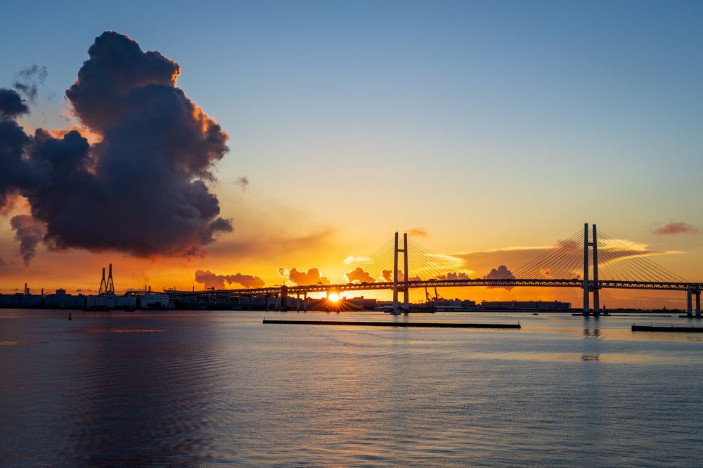 First sun rays behind the bridge
