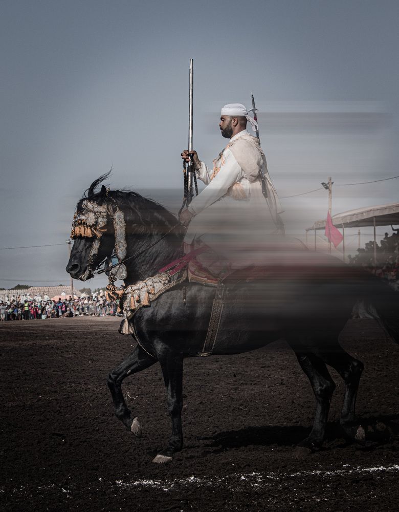 Elegant Equestrian: A Knight in Stylish Attire Riding a Horse
