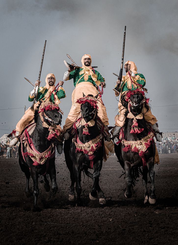 Capture the electrifying moment as gallant knights fire rifles while riding on horseback, showcasing their extraordinary skills