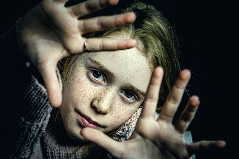 Eyes closed in hands