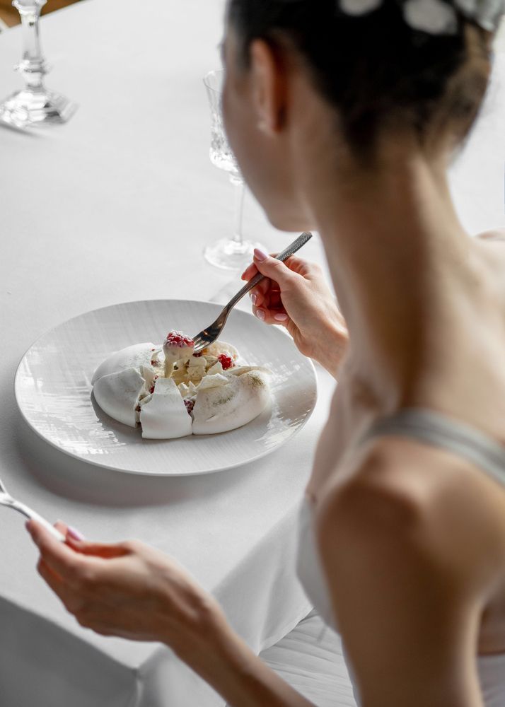 Ballerina eating a Pavlova desert