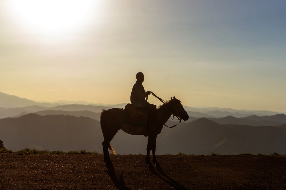 A man with local horse in Gadabay mountains Azerbaijan