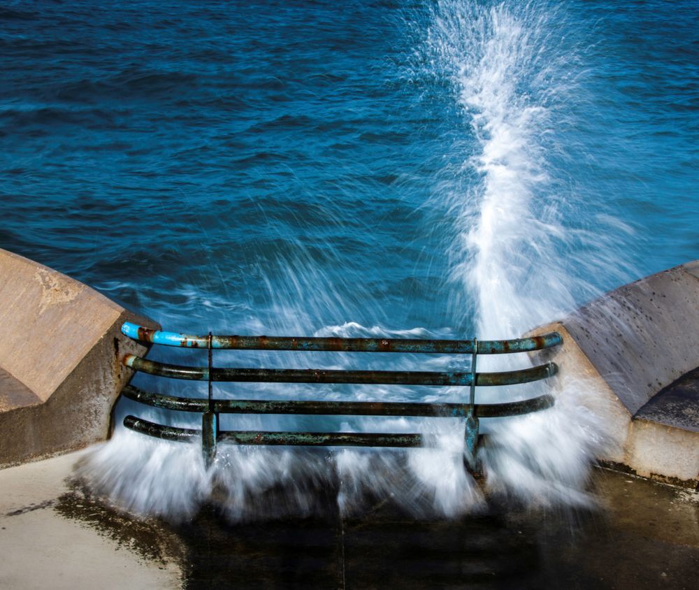 waves breaking on a pier