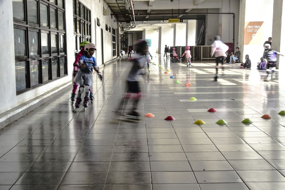 Children practice roller skating