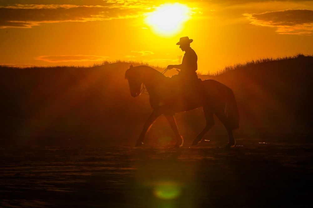 Passeio a cavalo na praia