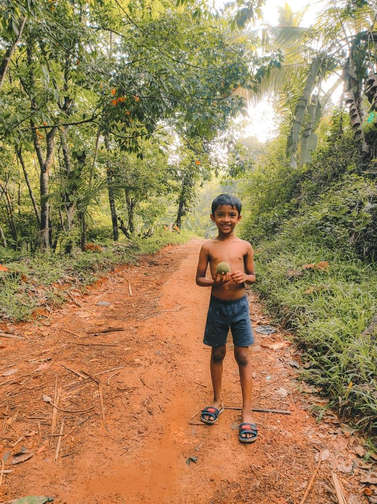 The village boy holding a ball