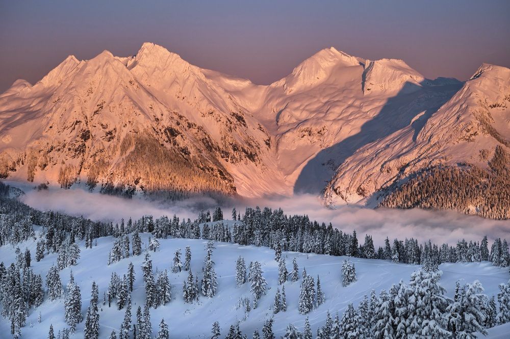 Fresh snow on mountains at sunrise