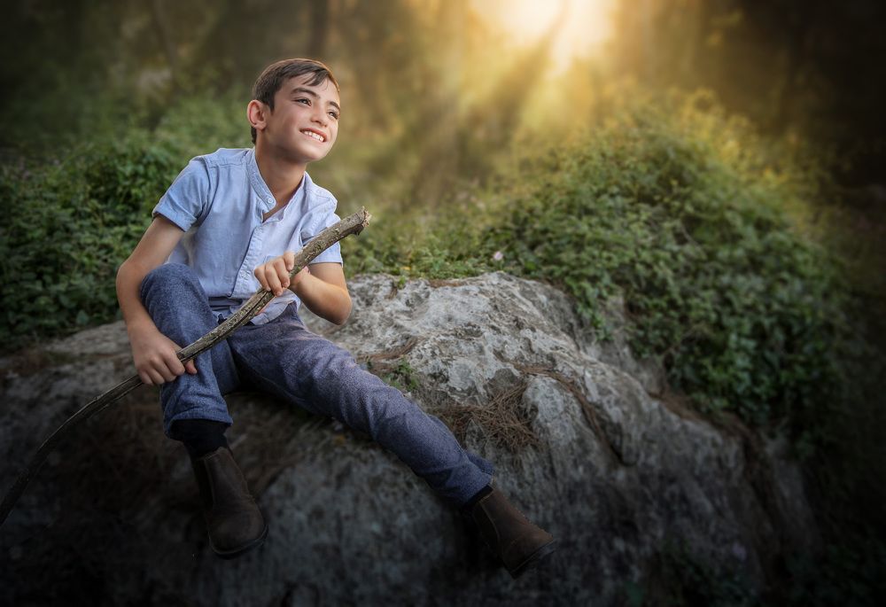 A boy on a sunset background