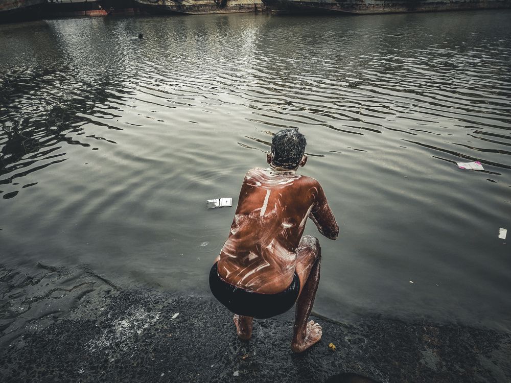 While bathing at the river side....