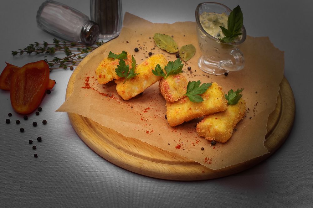 Meat in batter with parsley and sauce