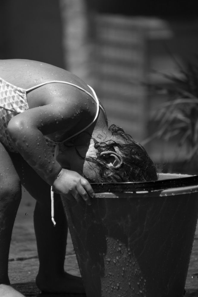 Little girl and a bucket
