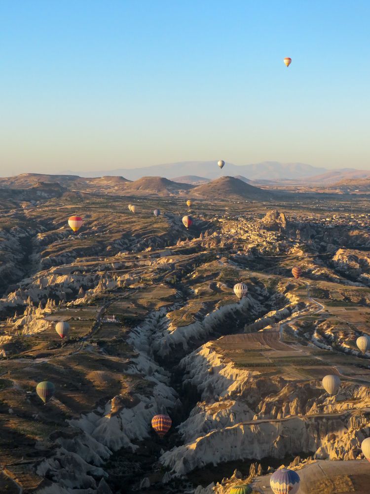 Unusual landscape of Cappadocia and hot air balloons