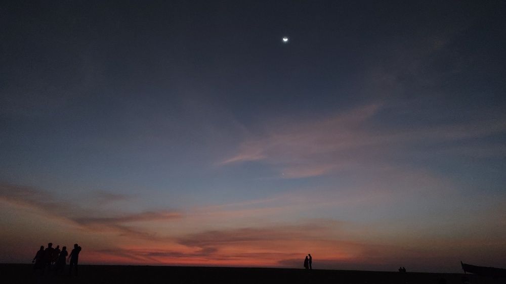 The couple in sunset with moon