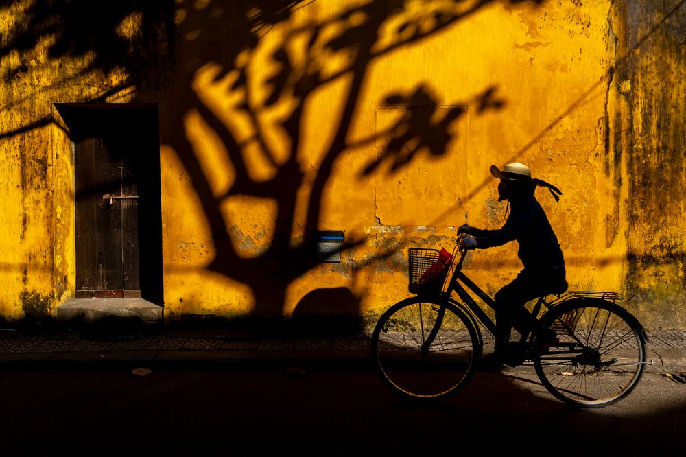 The Cyclist Against Yellow Wall